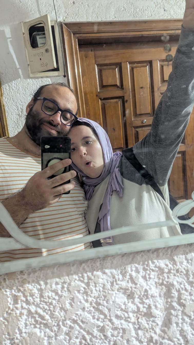 Ziad and Jessy taking a mirror photo together